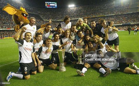 Valencia's players celebrate on their field in Valencia with their ...