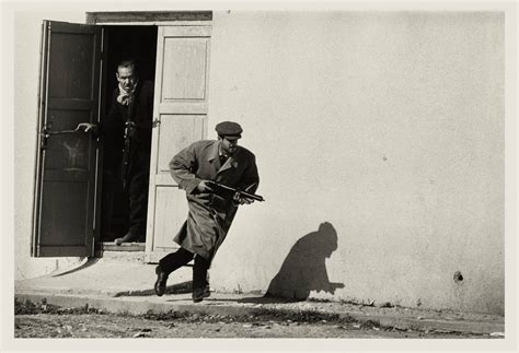 A Turkish resistance fighter runs towards the fighting during the Cyprus civil war. Photo by Don ...