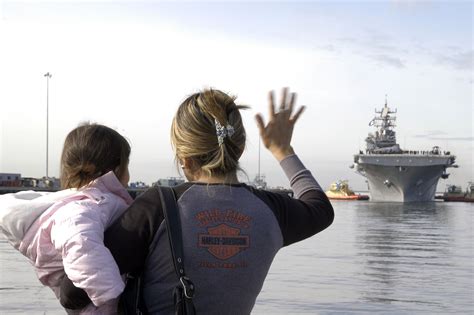 File:US Navy 041206-N-7281D-040 Family members wave goodbye as the amphibious assault ship USS ...