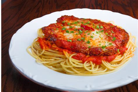 Veal Parmesan - Parmesan-crusted pounded veal cutlet topped with melted mozzarella over ...