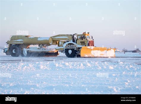 Clearing airport from snow during snow storm. clearing runway from snow. Clearing snow with ...