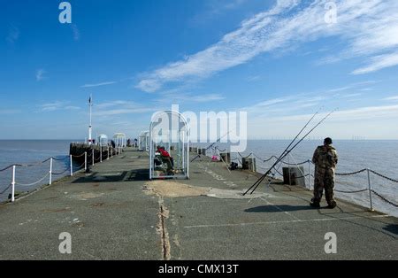 People fishing from Clacton Pier Stock Photo - Alamy