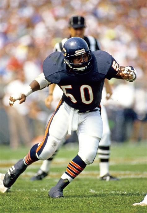 John McCormick, QB, hands off to Wendell Hayes, RB. Denver Broncos vs ...