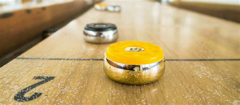 Electric Shuffle | A New Tabletop Shuffleboard Bar From Flight Club