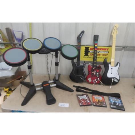 3 Guitar Hero Guitars and Drum Set