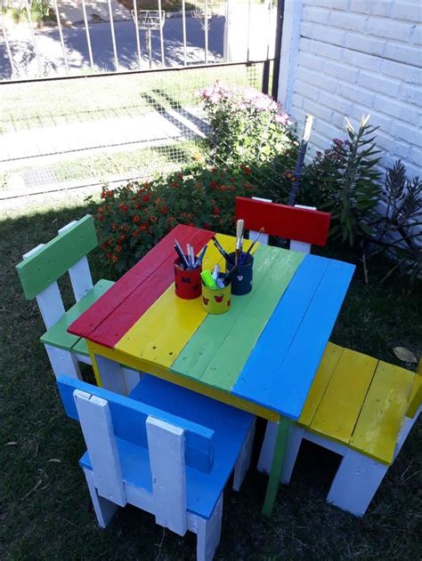 an outdoor table and chairs painted in different colors