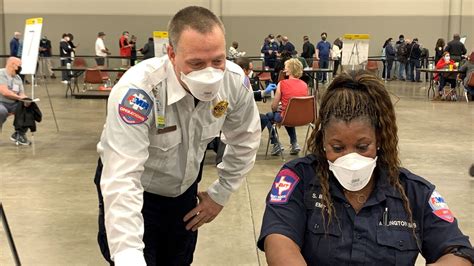 At an Arlington COVID-19 vaccination site, a first responder sees ‘the ...