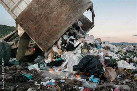 Garbage truck at landfill Stock Photo | Adobe Stock