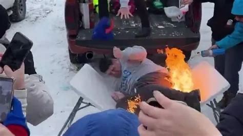 NFL fan body slammed into burning table before his butt catches fire ...