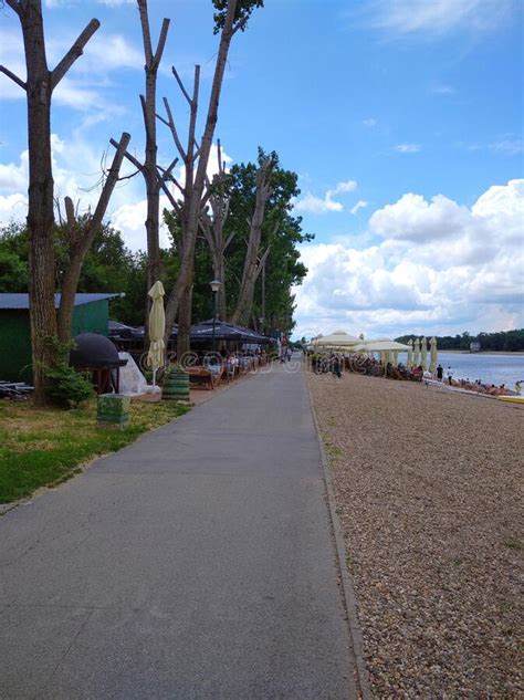 : People Relaxing on the Alleys with Restaurants of a Park Near Ada Ciganlija Lake , Serbia ...