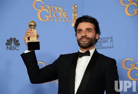 Photo: Oscar Isaac wins an award at the 73rd annual Golden Globe Awards ...