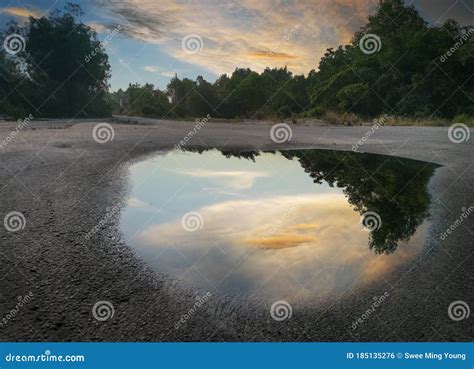 Twilight Puddle On The Asphalt Rain Reflection Of Light In The Waves Stock Image | CartoonDealer ...