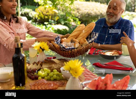 Family eating together at table Stock Photo - Alamy