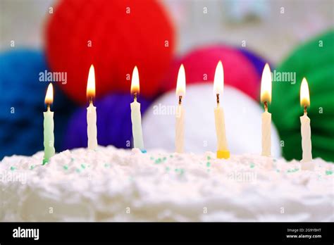 Birthday cake with candles on colorful background Stock Photo - Alamy