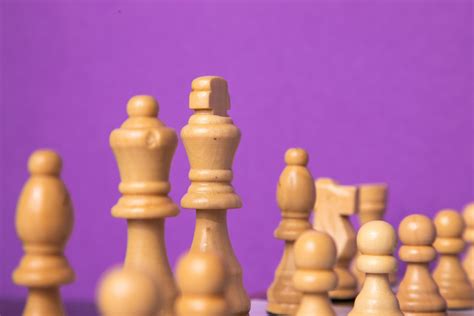 White chess pieces on purple background - PixaHive