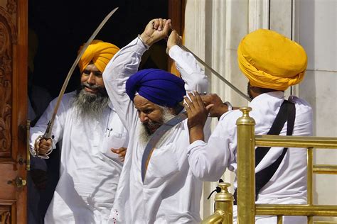 Sikhs wield swords during their clash the Golden Temple - Mirror Online