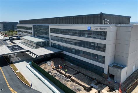 City of Hope’s new Irvine cancer center welcomes first patients with ride on a big orange ...