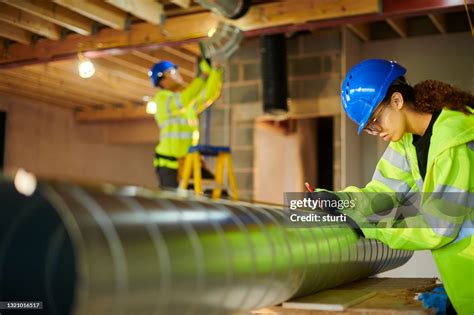 Air Conditioning Duct Install High-Res Stock Photo - Getty Images