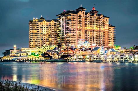 Emerald Grand and HarborWalk Village at night with lights reflecting in ...