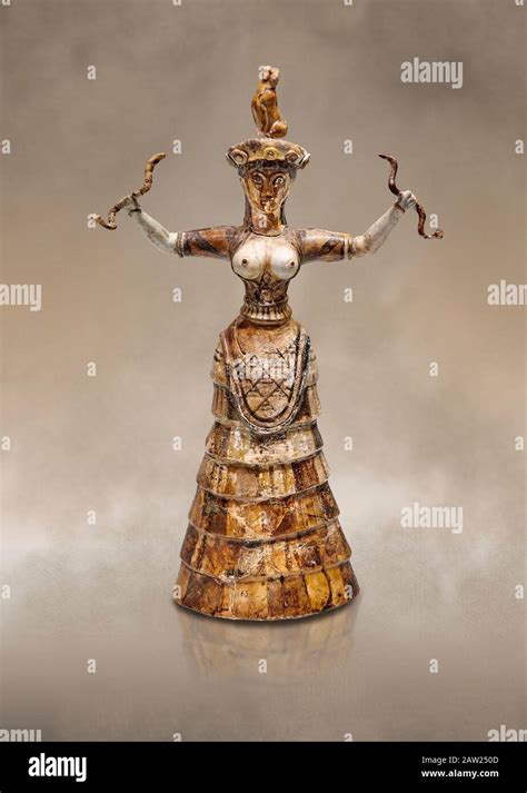 Minoan Snake Goddess statue arms raised holding 2 snakes from the ...