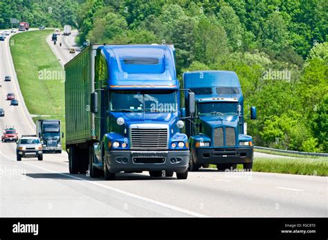 Two Blue Semi Trucks Climb Hill On Interstate Highway in Tennessee ...