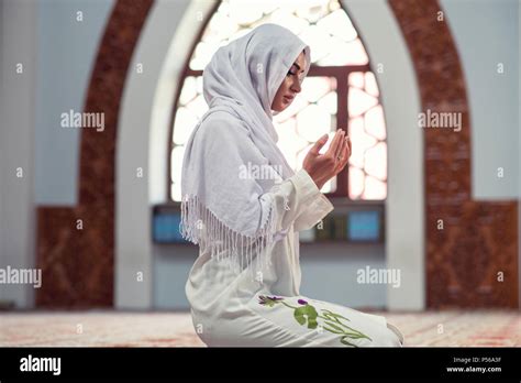 Arabic Young muslim woman praying in mosque Stock Photo - Alamy