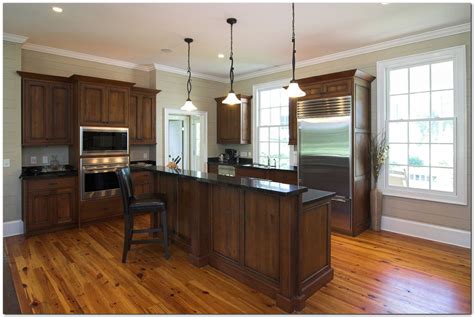 Awesome Laminate Wood Flooring in Kitchen Ideas - The Urban Interior | Walnut kitchen cabinets ...