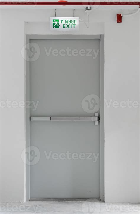 Emergency exit with sign 13455411 Stock Photo at Vecteezy