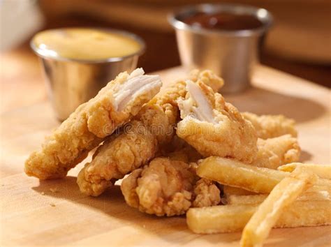 Fried Chicken Strips with French Fries and Sauce. Stock Image - Image ...