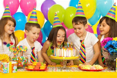 Group of joyful little kids with cake at birthday party Stock Photo by ...