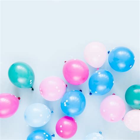 Premium Photo | Colorful balloons on pastel blue background. festive or ...