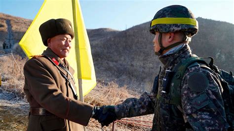 North and South Korean soldiers shake hands, exchange cigarettes during DMZ inspections - ABC News
