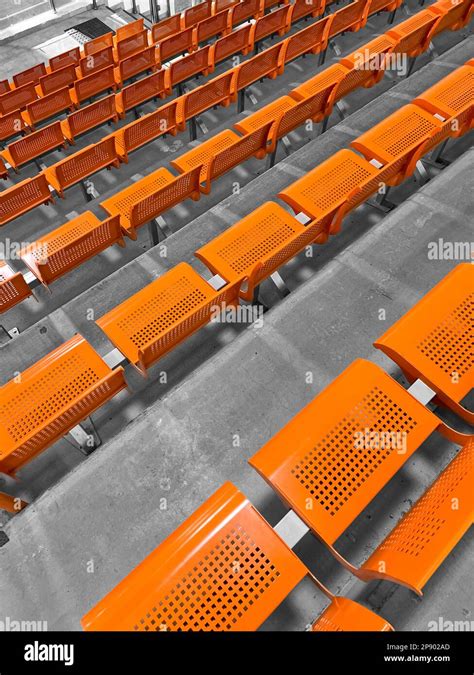 View of orange seats in stadium Stock Photo - Alamy