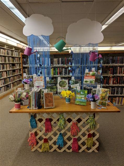 a table with books and flowers on it in a library