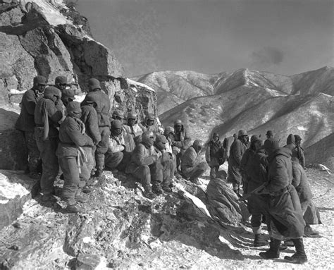 Chinese troops surrender to U.S. Marines during the Battle of Chosin Reservoir, Koto-ri, North ...