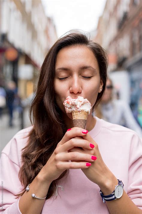 "Beautiful Young Woman Eating Ice Cream In Covent Garden, London" by ...