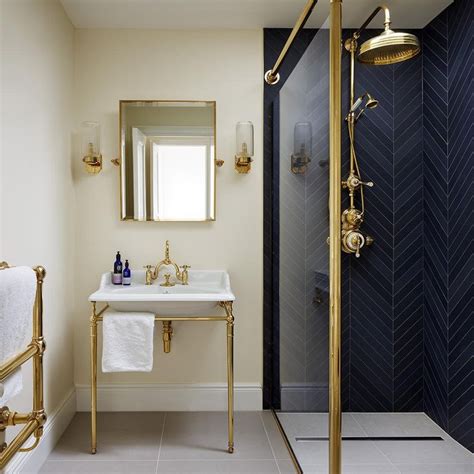 a bathroom with a sink, mirror and shower stall in the middle of the room