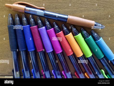Colorful pens on drafting table Stock Photo - Alamy