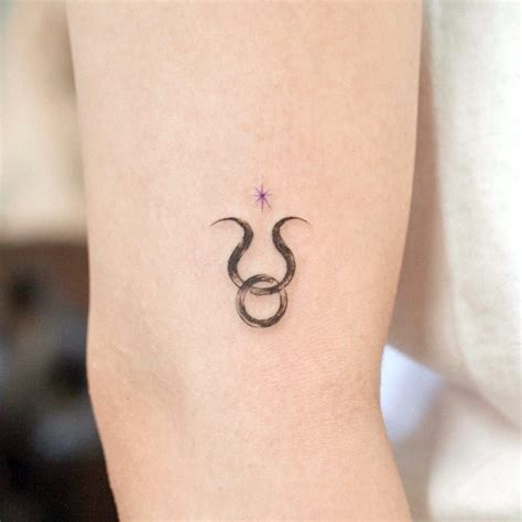 a woman's arm with a small tattoo on the left side of her body