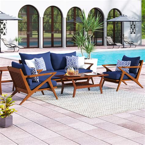 scandinavian outdoor furniture set with blue cushions solid wood frames ...