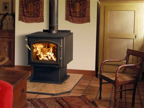 Country flame wood stove on Custom-Fireplace. Quality electric, gas and wood fireplaces and stoves.