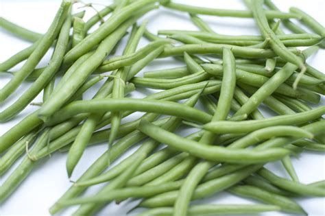 Free Image of Fresh Picked Green Snap Beans on White Background | Freebie.Photography