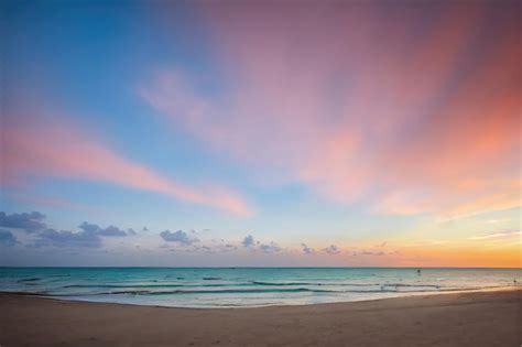 Premium Photo | Sunset in a beautiful beach. calm sea