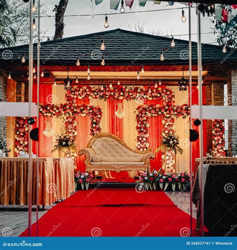 Wedding Stage Decorated in Red and Gold with White Garlands Stock Image - Image of love, gold ...