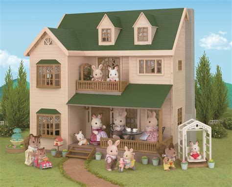 a doll house with many dolls in front of it