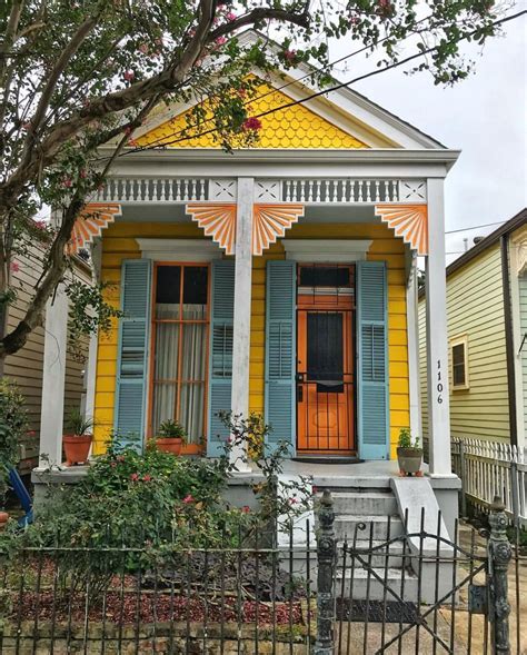 Yellow House with Blue Shutters and Red Door