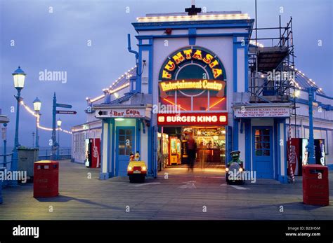 Pier and beach at night Eastbourne England Stock Photo - Alamy