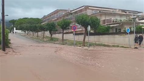 Spain: Muddy water rushes down street as rain causes major flooding | Climate | Independent TV