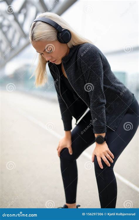 Exhausted Female Runner Resting with Hands on Knees after Workout Stock Photo - Image of break ...