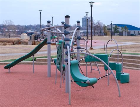 Playground Equipment with Padded Play Area at a Park Stock Image - Image of recreation ...